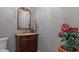 Stylish powder room with a dark wood vanity and gold mirror at 1713 North Dr, Sarasota, FL 34239