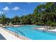 Refreshing community pool with lounge chairs and ample space for relaxation at 401 N Point Rd # 901, Osprey, FL 34229