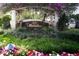 The Oaks Preserve Meridian entrance, lush landscaping, and a welcoming sign at 401 N Point Rd # 901, Osprey, FL 34229