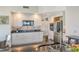 Modern kitchen featuring stainless steel appliances and white cabinetry at 401 N Point Rd # 901, Osprey, FL 34229