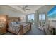 Main bedroom with a king-size bed and balcony access at 401 N Point Rd # 901, Osprey, FL 34229