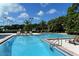 Large community pool with plenty of lounge chairs at 401 N Point Rd # 901, Osprey, FL 34229