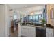 Stylish kitchen with dark granite counters and white cabinets at 401 N Point Rd # 901, Osprey, FL 34229