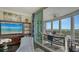 Living room with access to a balcony and water views at 401 N Point Rd # 901, Osprey, FL 34229
