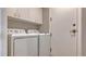 Laundry room with washer and dryer, and extra storage at 401 N Point Rd # 901, Osprey, FL 34229