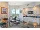 Bright kitchen with granite counters, white cabinets, and a breakfast nook at 401 N Point Rd # 901, Osprey, FL 34229