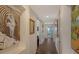 Bright hallway with artwork and wood floors at 401 N Point Rd # 901, Osprey, FL 34229
