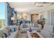 Elegant living room featuring a comfortable sofa and stylish decor at 401 N Point Rd # 901, Osprey, FL 34229