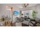 Home office with leather seating, large artwork, and built-in bar at 401 N Point Rd # 901, Osprey, FL 34229