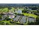 Aerial view of community with golf course, lake, and tennis courts at 401 N Point Rd # 901, Osprey, FL 34229