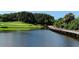 Wooden bridge over water feature on golf course at 401 N Point Rd # 901, Osprey, FL 34229