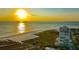 Aerial view of beachfront property at sunset at 5400 Ocean Blvd # 6-4, Sarasota, FL 34242