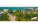 Beachfront homes and tropical landscaping near the ocean at 5400 Ocean Blvd # 6-4, Sarasota, FL 34242