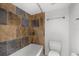 Bathroom with tub and updated tile at 5400 Ocean Blvd # 6-4, Sarasota, FL 34242