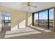 Bedroom with large windows and city view at 5400 Ocean Blvd # 6-4, Sarasota, FL 34242
