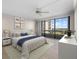 Main bedroom with large windows and city view at 5400 Ocean Blvd # 6-4, Sarasota, FL 34242