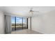 Bedroom with large windows and city view at 5400 Ocean Blvd # 6-4, Sarasota, FL 34242