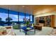 Ocean view sitting area with comfortable furniture and a bookcase at 5400 Ocean Blvd # 6-4, Sarasota, FL 34242