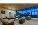Common area with ocean view, wicker furniture, and coffee table at 5400 Ocean Blvd # 6-4, Sarasota, FL 34242