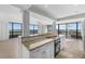 Open kitchen with granite countertops and breakfast bar at 5400 Ocean Blvd # 6-4, Sarasota, FL 34242