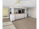 Bright kitchen with white cabinets, granite countertops, and breakfast bar pass-through at 5400 Ocean Blvd # 6-4, Sarasota, FL 34242