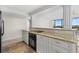 Modern kitchen with granite countertops and stainless steel appliances at 5400 Ocean Blvd # 6-4, Sarasota, FL 34242