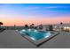 Tranquil lighted pool at night with beach view at 5400 Ocean Blvd # 6-4, Sarasota, FL 34242