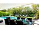 Inviting pool area with a dining table and lounge chairs at 676 Key Royale Drive, Holmes Beach, FL 34217