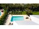 Aerial view of a refreshing pool and spacious backyard at 676 Key Royale Drive, Holmes Beach, FL 34217
