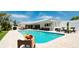 Large, refreshing pool with plenty of lounge chairs for sunbathing at 676 Key Royale Drive, Holmes Beach, FL 34217