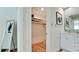 Bright walk-in closet with ample shelving and hanging space at 676 Key Royale Drive, Holmes Beach, FL 34217