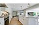 Open kitchen with a view into the dining and living areas at 676 Key Royale Drive, Holmes Beach, FL 34217