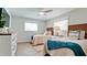 Cozy bedroom with twin beds, stylish decor, and plenty of natural light at 676 Key Royale Drive, Holmes Beach, FL 34217