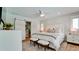 Spacious main bedroom with a king-size bed, ensuite bathroom, and barn door at 676 Key Royale Drive, Holmes Beach, FL 34217