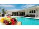 Expansive pool area with lounge chairs and outdoor seating at 676 Key Royale Drive, Holmes Beach, FL 34217