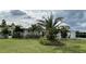 Single-story home with white exterior at 676 Key Royale Drive, Holmes Beach, FL 34217