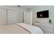 Relaxing bedroom with a comfortable bed, ample closet space, and a large TV at 676 Key Royale Drive, Holmes Beach, FL 34217