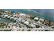 Aerial view of a single Gathering home with private pool, located in a waterfront community at 676 Key Royale Drive, Holmes Beach, FL 34217