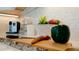 Kitchen detail showing fresh produce on a wood cutting board at 676 Key Royale Drive, Holmes Beach, FL 34217