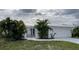 Single-story home with white exterior at 676 Key Royale Drive, Holmes Beach, FL 34217