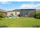 Spacious backyard with lanai and lush landscaping at 27855 Arrowhead Cir, Punta Gorda, FL 33982