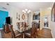 Bright dining area features a glass-top table and chairs, along with a wine bar at 27855 Arrowhead Cir, Punta Gorda, FL 33982
