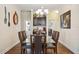 Elegant dining room with a glass-top table and wine storage at 27855 Arrowhead Cir, Punta Gorda, FL 33982