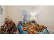 Charming bedroom with a Scooby Doo themed bedspread and numerous stuffed animals at 27855 Arrowhead Cir, Punta Gorda, FL 33982