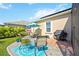 Landscaped backyard with patio furniture and grill at 27855 Arrowhead Cir, Punta Gorda, FL 33982