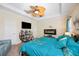 Relaxing main bedroom with king bed, TV, and fireplace at 27855 Arrowhead Cir, Punta Gorda, FL 33982