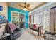 Relaxing sunroom with comfy seating and tiled floors at 27855 Arrowhead Cir, Punta Gorda, FL 33982