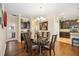 Elegant dining room features a glass-top table, dark wood chairs, and a wine rack at 27855 Arrowhead Cir, Punta Gorda, FL 33982