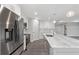 Modern kitchen with stainless steel appliances and expansive island at 214 Lime Tree Park, Rotonda West, FL 33947