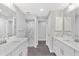 Elegant bathroom with double vanity, marble shower, and modern fixtures at 214 Lime Tree Park, Rotonda West, FL 33947